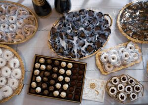 a table topped with lots of different types of desserts